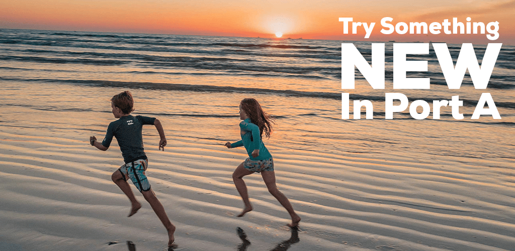 Try Something New In Port Aransas Texas kids running on the beach against a beautiful sunset