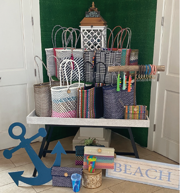Gifts for the holidays assortment of beach inspired gifts on a table with a cute blue anchor on floor