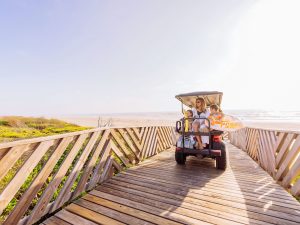 Family On Golf Cart Using Dune Crossover