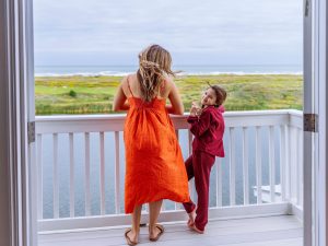 Mother And Daughter On Balcony At Palmilla Beach