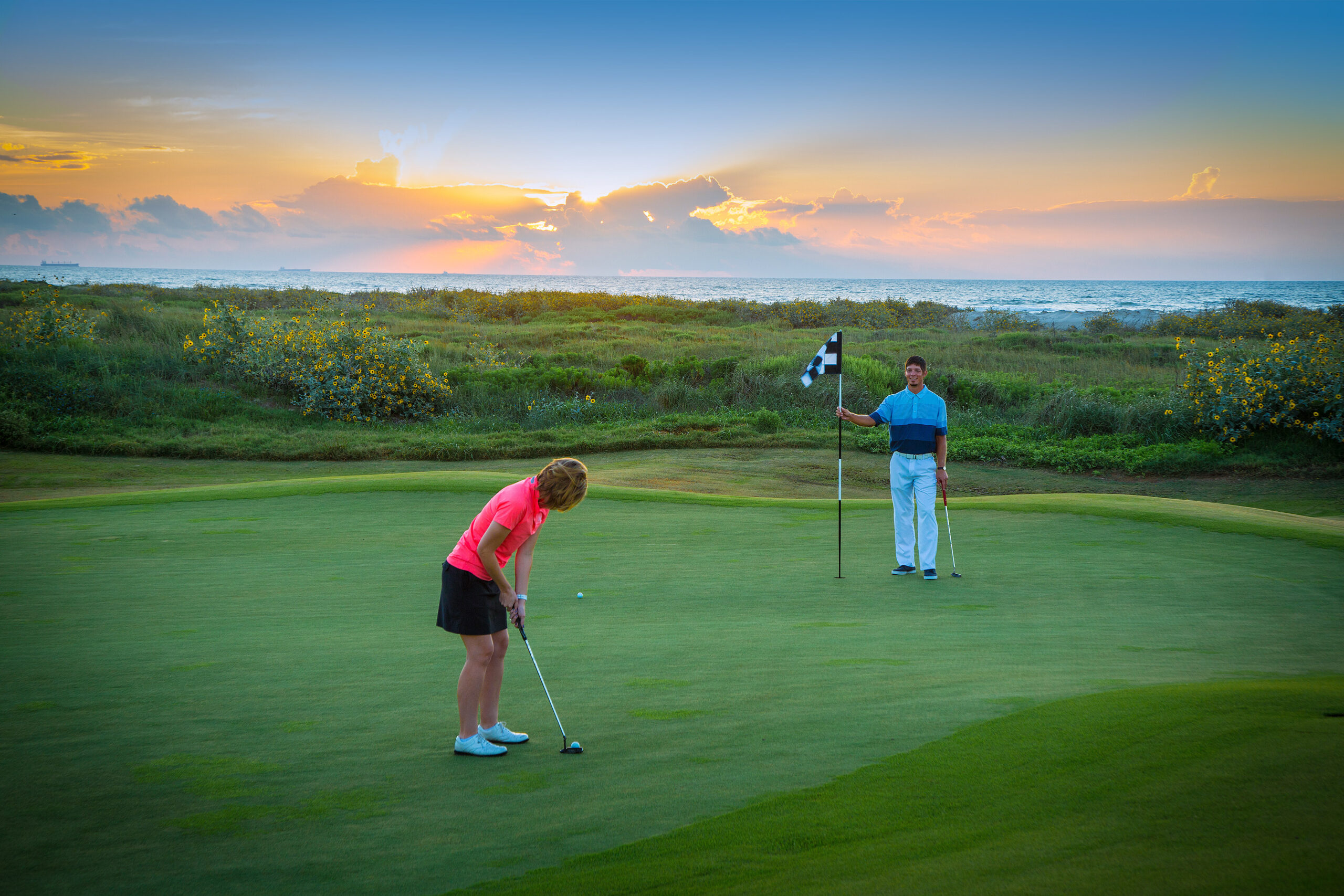 Couple Enjoying Golf at Links-style Golf Course at Palmilla Beach in Port Aransas Texas