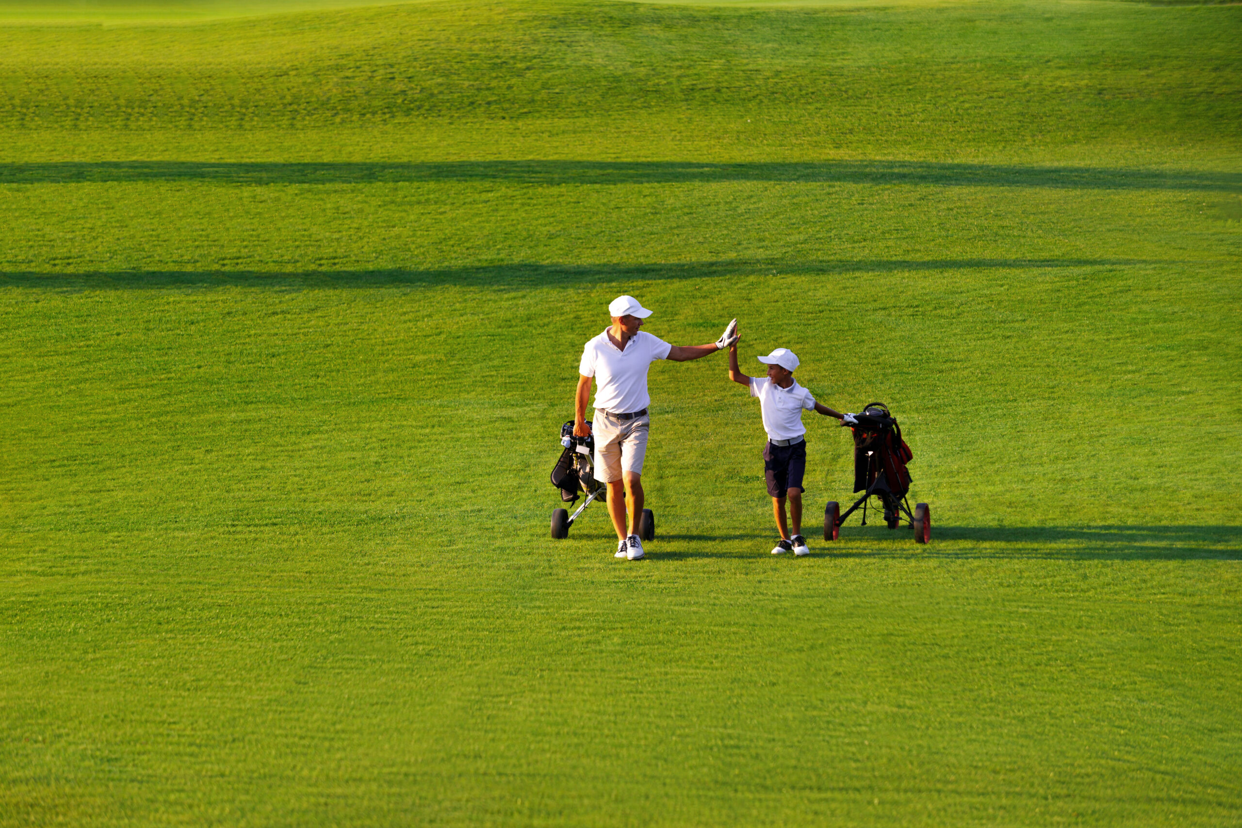Father and Son Enjoying Links-style Golf Course at Palmilla Beach in Port Aransas Texas