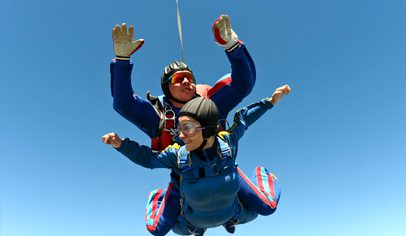 People Enjoying Skydiving Near Palmilla Beach